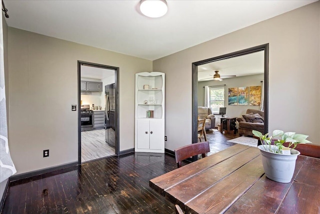 dining space featuring baseboards, ceiling fan, and hardwood / wood-style flooring