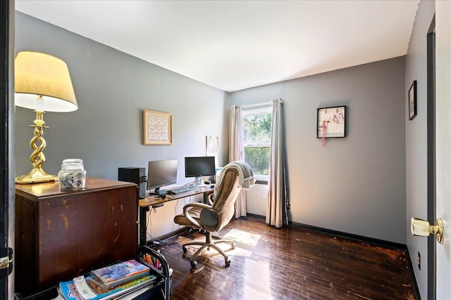 office space with hardwood / wood-style floors and baseboards