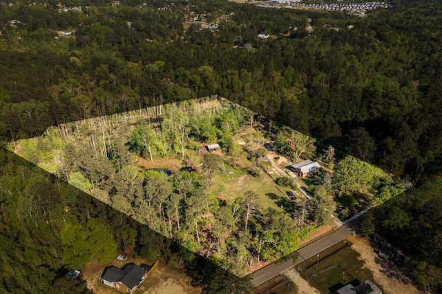 aerial view featuring a view of trees