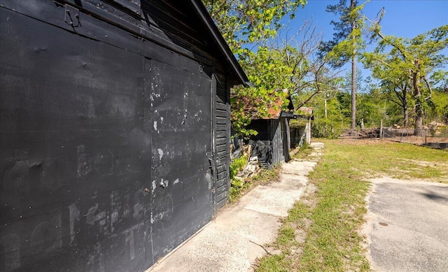 view of property exterior with fence