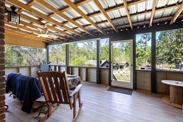 sunroom featuring ceiling fan