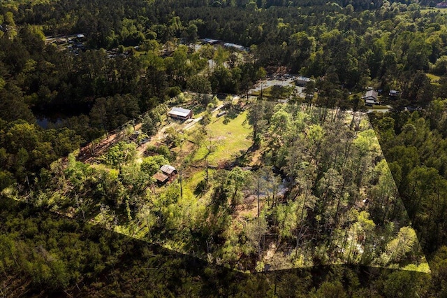 birds eye view of property with a wooded view