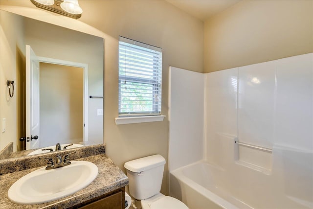 full bathroom with shower / tub combination, vanity, and toilet