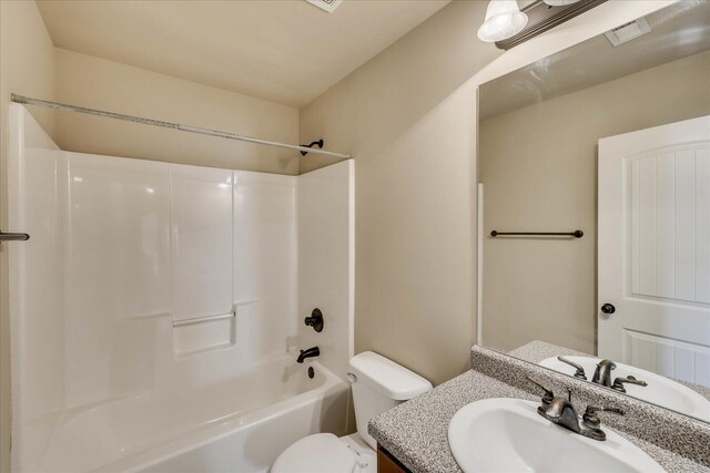 full bathroom with vanity, toilet, and bathtub / shower combination