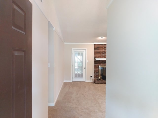 hallway featuring light carpet and crown molding