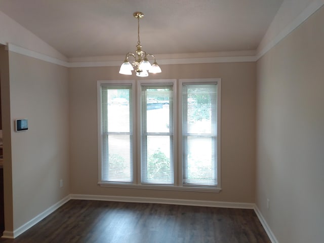 unfurnished dining area featuring vaulted ceiling, dark wood-type flooring, and an inviting chandelier