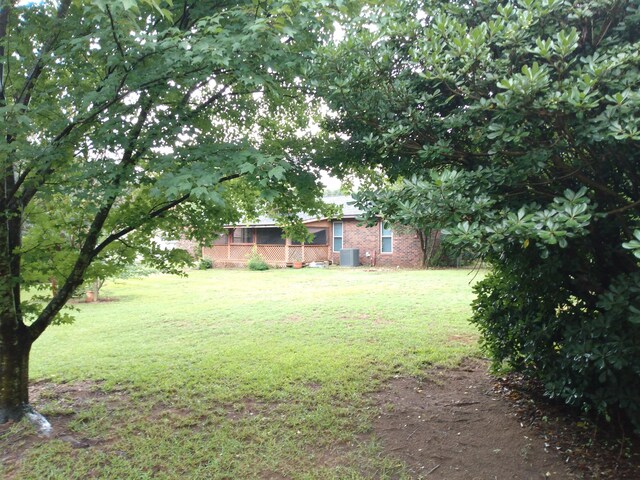 view of yard with central AC unit