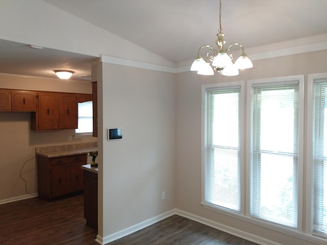 unfurnished dining area with a chandelier, vaulted ceiling, and dark wood-type flooring