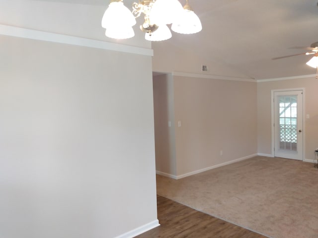 empty room with crown molding, carpet floors, and ceiling fan with notable chandelier