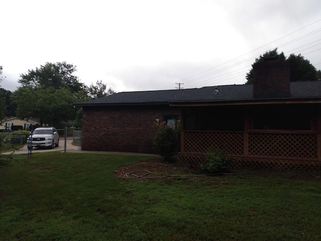 view of home's exterior with a yard