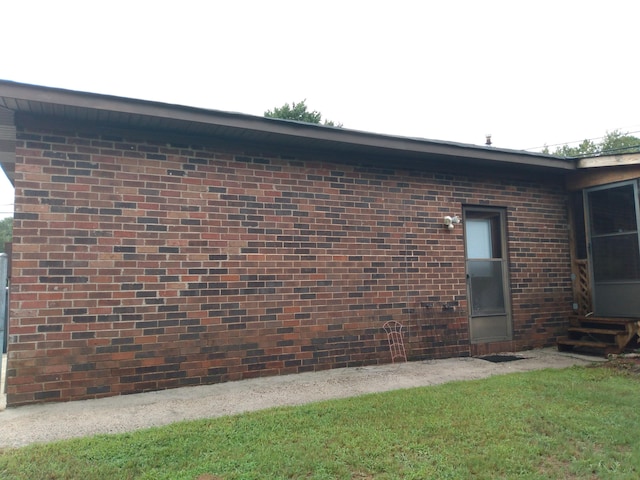 view of home's exterior featuring a lawn