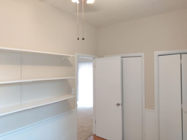 unfurnished bedroom featuring two closets