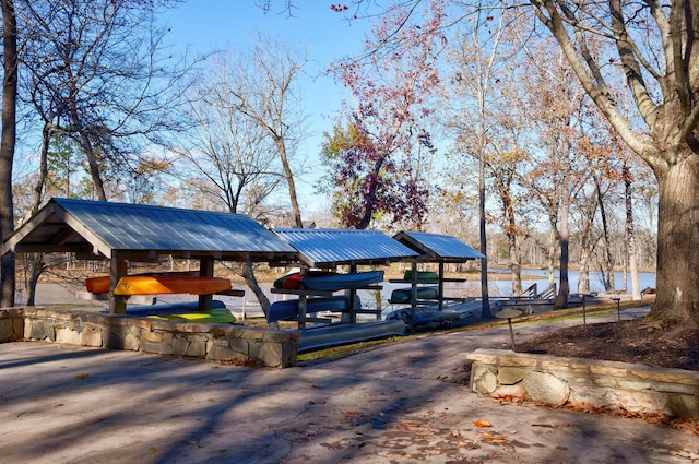 surrounding community featuring a water view