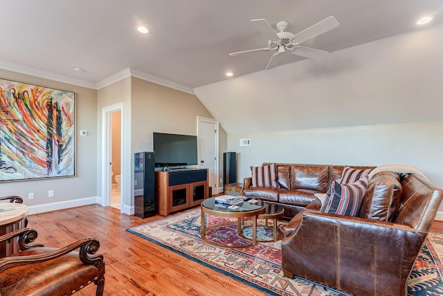 living room with light hardwood / wood-style floors, vaulted ceiling, ceiling fan, and crown molding