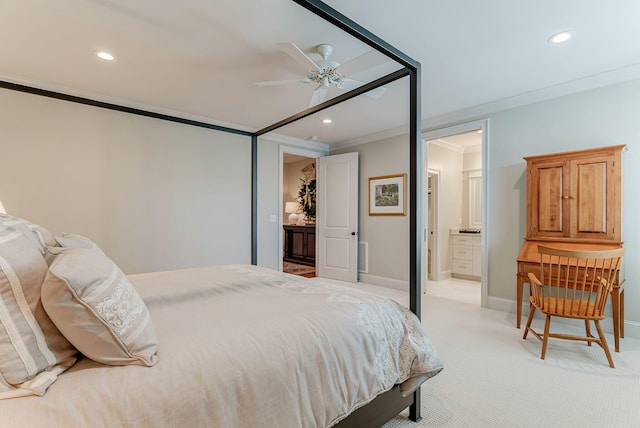 bedroom with ceiling fan, crown molding, connected bathroom, and light carpet