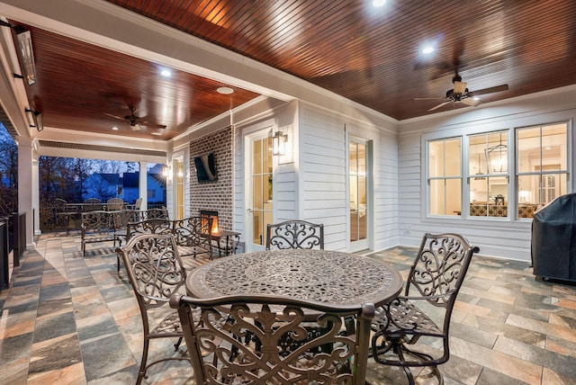 view of patio featuring area for grilling and ceiling fan