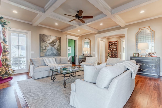 living room with beamed ceiling, a healthy amount of sunlight, and coffered ceiling