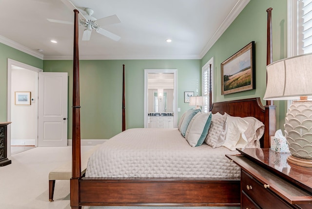 bedroom with carpet, connected bathroom, ceiling fan, and ornamental molding