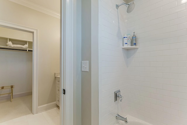 bathroom featuring vanity, tub / shower combination, tile patterned floors, and ornamental molding