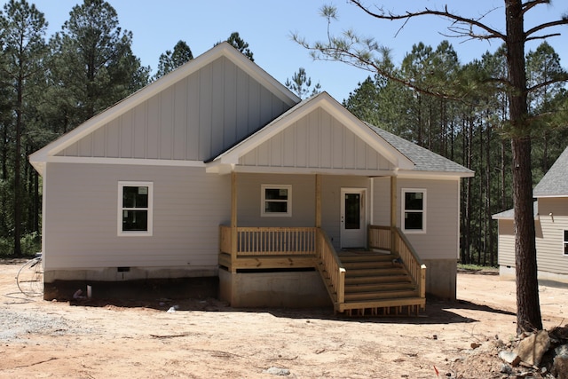 1192 Sunset Cv, Tignall, GA 30668 - view of front of house featuring board and batten siding, a porch, a shingled roof, and crawl space