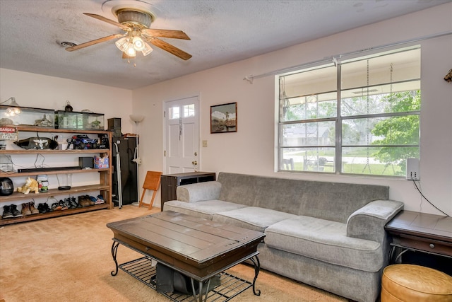 1219 Susan Ct, Waynesboro, GA 30830 - living room featuring a textured ceiling, visible vents, light colored carpet, and a ceiling fan