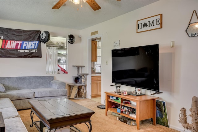 1219 Susan Ct, Waynesboro, GA 30830 - living area with a textured ceiling, a ceiling fan, and light carpet