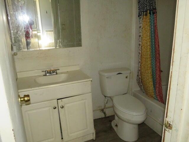 full bath with toilet and vanity