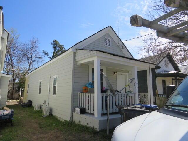 view of property exterior featuring a porch