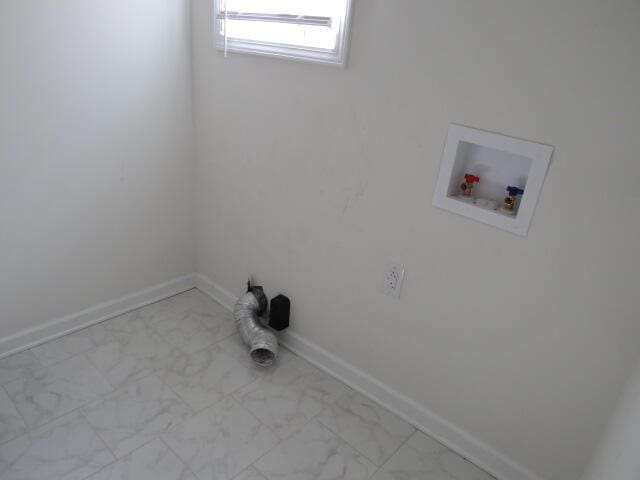 laundry area with washer hookup, marble finish floor, baseboards, and laundry area