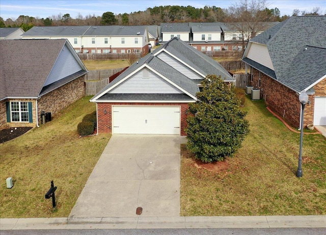 view of front facade with a front yard and a garage