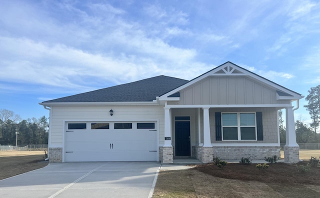 craftsman-style house with a porch and a garage