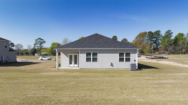 rear view of property with a yard and french doors