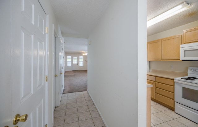 107 Barts Dr, Augusta, GA 30909 - kitchen featuring white appliances, light brown cabinets, a textured ceiling, light tile patterned floors, and light countertops