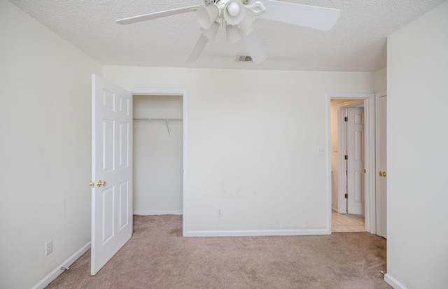 107 Barts Dr, Augusta, GA 30909 - unfurnished bedroom with carpet floors, a textured ceiling, a closet, a ceiling fan, and baseboards