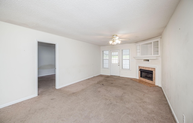 107 Barts Dr, Augusta, GA 30909 - unfurnished living room featuring a ceiling fan, a premium fireplace, carpet, a textured ceiling, and baseboards