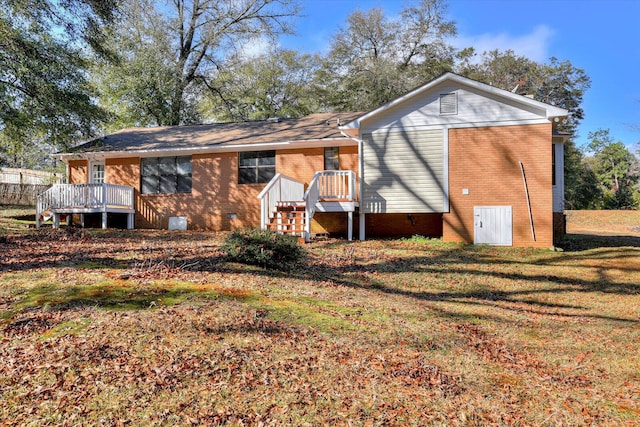 back of house with a yard