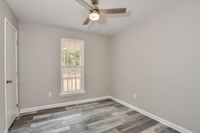 spare room with ceiling fan and hardwood / wood-style flooring