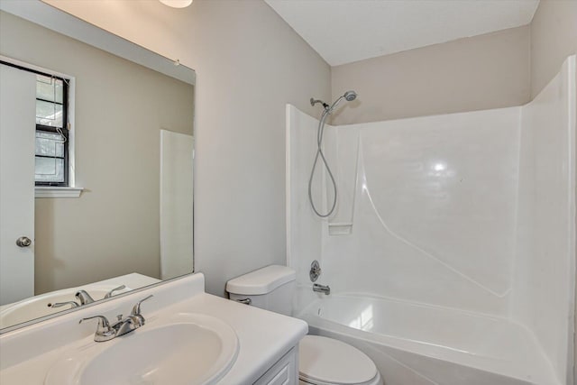 full bathroom featuring vanity, tub / shower combination, a textured ceiling, and toilet