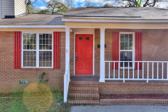 doorway to property featuring covered porch