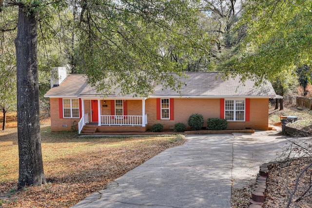 single story home with covered porch