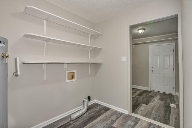 laundry area featuring a textured ceiling, hookup for a washing machine, and dark hardwood / wood-style floors