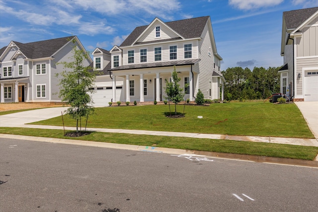 view of front of property featuring concrete driveway, a standing seam roof, a front lawn, covered porch, and a shingled roof