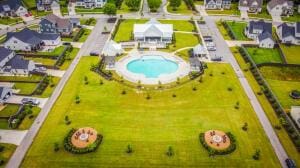 aerial perspective of suburban area featuring a pool