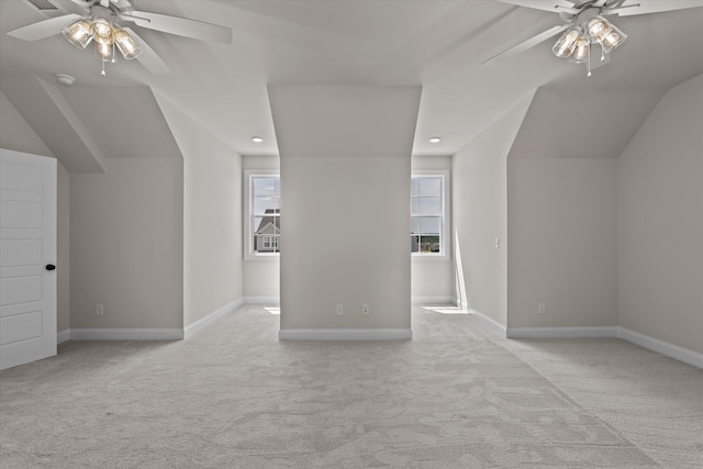 additional living space with ceiling fan, light carpet, vaulted ceiling, recessed lighting, and baseboards