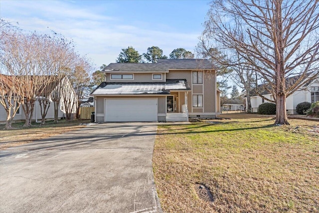 view of front of property with a garage and a front yard