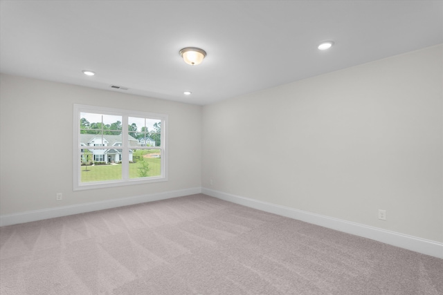 309 Militia Loop, North Augusta, SC 29860 - spare room featuring light colored carpet, baseboards, and recessed lighting