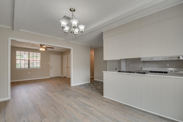 kitchen with white cabinets, sink, stainless steel appliances, and a textured ceiling