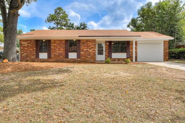 ranch-style house with a front lawn, covered porch, and a garage