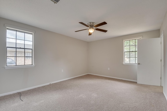 unfurnished room featuring carpet flooring and ceiling fan