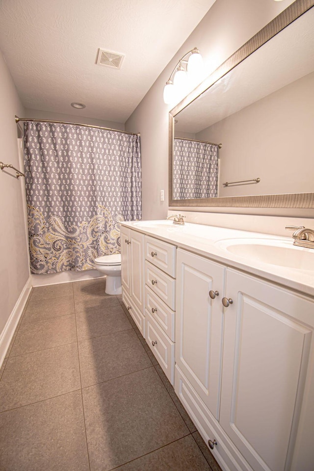 1144 Bubbling Springs Dr, Graniteville, SC 29829 - bathroom with a shower with shower curtain, visible vents, double vanity, tile patterned flooring, and toilet